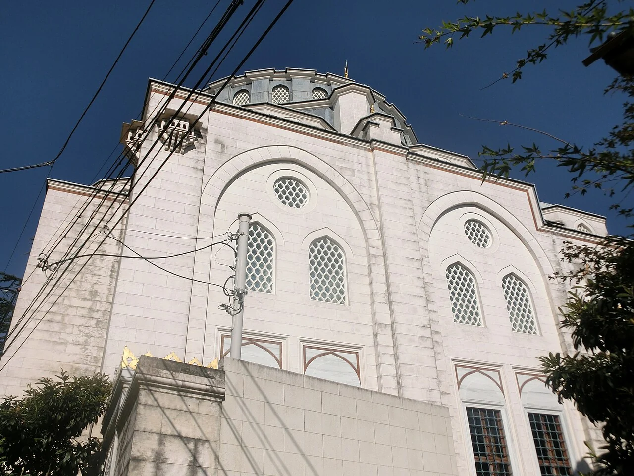 Exterior of Tokyo Camii mosque beneath a blue sky.